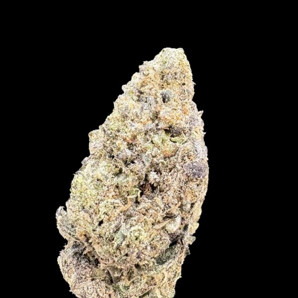 Close-up of a frosty cannabis bud with green and purple hues on a black background the surface covered in white trichomes.