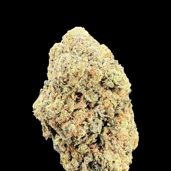 Close-up of a dense cannabis bud covered in white trichomes against a black background.